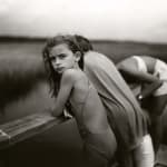 Sally Mann Immediate Family series, Jessie in the Wind, photograph of young girl Jessie in bathing suit with hair blowing in the wind