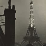 Ilse Bing photograph of Eiffel Tower illuminated at night in Paris