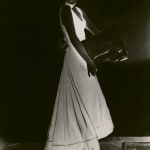 Dora Maar, Untitled (fashion), c. 1934, inverse black and white image of woman in dress that appears white