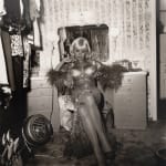 Diane Arbus, Topless dancer in her dressing room, San Francisco, CA , 1968
