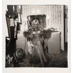 Diane Arbus, Topless dancer in her dressing room, San Francisco, CA , 1968