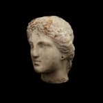 Greek, A Greek marble female head, Hellenistic, circa 4th - 3rd century BC