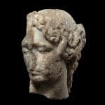 Roman, A Roman marble fragmentary head of a sleeping woman, circa 2nd century AD