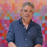 Matthew Johnson posing with his painting "Immersion I' during his solo exhibition in the kellilundberg.art main gallery on the Mornington Peninsula.