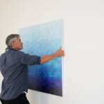 Installation shot of Matthew Johnson with his oil on canvas painting 'Marine Dusk Descent'.
