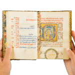 a richly illuminated medieval manuscript, an Italian Book of Hours made in Roma, signed and dated