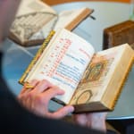 a richly illuminated medieval manuscript, an Italian Book of Hours made in Roma, signed and dated