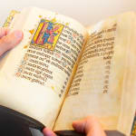 a richly illuminated medieval manuscript, an Italian Book of Hours made in Roma, signed and dated