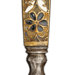 Dutch penknife with an enameled handle topped with a Bust of Bacchus, detail showing floral pattern in dark blue and gold, with ornate geometric design and silver base. Close-up photograph highlighting decorative craftsmanship.