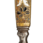 Dutch penknife with an enameled handle topped with a Bust of Bacchus, detail showing floral pattern in dark blue and gold, with ornate geometric design and silver base. Close-up photograph highlighting decorative craftsmanship.