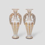 Bohemian Glass Manufactory Pair of gilt and white glass "Alhambra" vases, circa 1900 gilt and white glass vases of "Alhambra" form, decorated with elaborate gilt scrollwork, with applied cut glass flat handles 35 x 16 x 16 cm