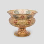 Philippe-Joseph BROCARD (1831-1896) Historical Mamluk-revival gilt and enameled glass stemmed cup, 1891 signed ‘Brocard Paris 1891 Exposition de Londres’ amber glass stem basin with birds in red medallions and Kufic inscriptions on base 22.5 x 30 x 30 cm
