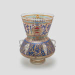 Pair of Mamluk-revival enameled clear glass Mosque lamps, circa 1900 clear glass Mosque lamps applied with six curved loops under a high conical neck, decorated with rows of gilt enameled Kufic inscriptions against blue background 42.5 x 33 x 33 cm