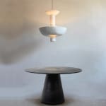 Cissbury pendant hanging above a round table