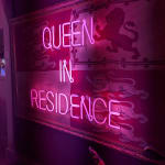 Queen in Residence neon on vintage flag