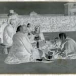 “Bread and Hope: A Family’s First Meal in America” Ellis Island NYC, c.1900s”, c.1900s