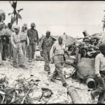 A. B. Knight, “At Ease” Using an unexploded 16 inch naval shell for a resting place, Marine Private First Class...