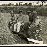 Famous shot of Allied commanders having a war conference by a haystack in a field in Northern France, 8.21.44, 1944