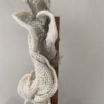 Crocheted wool and wire on wood sculpture profile view