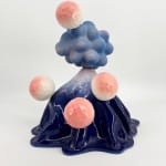 Volcano-shaped ceramic sculpture by Kartini Thomas with pink faceted spheres emerging from a glossy blue base, made of stoneware and porcelain.