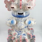 Close-up of biomorphic ceramic sculpture “Tattooed Space Monkey” (2025) by Kartini Thomas, showing pink-edged protrusions and fine blue motifs on glazed surface.