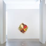 Installation view of Kimia Ferdowsi Kline’s artwork “Four Corners” hanging in a white gallery space with natural light and polished concrete floor