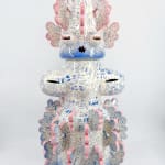 Ceramic sculpture titled “Tattooed Space Monkey” (2024) by Kartini Thomas, biomorphic figure adorned with blue drawings, 90 cm tall.