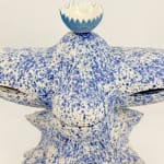 Detail of Kartini Thomas’s ceramic sculpture showing the porcelain lotus bowl atop a speckled blue form