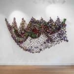 Large-scale textile installation by Nigerian artist Samuel Nnorom, featuring vibrant colors and intricate woven textures, exhibited at Galerie REVEL.
