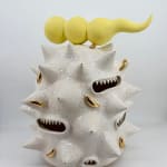 Kartini Thomas ceramic sculpture “Fat white spooter” with white spikes, yellow horn, and gold luster details