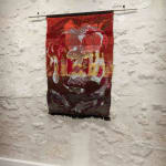 Jacquard textile artwork by Arda Asena, featuring intricate weaving techniques and abstract imagery, displayed at Galerie REVEL.