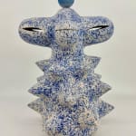 Ceramic sculpture by Kartini Thomas with speckled blue and white surface and porcelain lotus on top