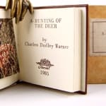 A-Hunting of the Deer by Charles Dudley Warner. Title page and sliupcover.