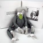 Uncorrected proof of The Headless Bust by Edward Gorey. Illustration and text spread with Bahhumbug doll