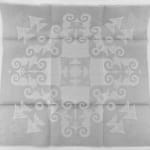 Pair of damask napkins: seahorses and fish. Unfolded napkin front