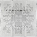 Pair of damask napkins: seahorses and fish. Unfolded napkin back