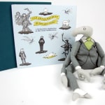 The Headless Bust: A Melancholy Meditation on the False Millennium. Cover and bahhumbug doll