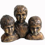 A bronze sculpture featuring three miniature busts of young boys, each measuring 13 cm tall. The boys are positioned close together, with detailed facial expressions and textured hair, capturing their individuality and youthful innocence. The patina highlights the natural bronze tones, giving depth to the piece.