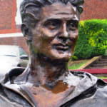 Close-up of Keith Miller's bronze portrait, capturing his confident demeanor and striking features. The intricate detailing highlights his legacy as an iconic Australian cricketer.
