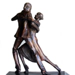 A side view of a bronze statuette showing a couple in a passionate tango pose. The man leans into the movement while the woman extends her leg elegantly, capturing the fluid dynamics of the dance.