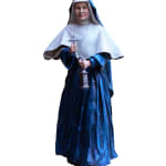 A resin statue of Jeanne-Marie Chavoin, founder of the Marist Sisters, unveiled against a black curtain backdrop. The statue captures Jeanne-Marie in her traditional religious habit, including a flowing blue gown and a white veil. She holds a cross in one hand and a lantern in the other, symbolizing faith and guidance. The sculpture stands on a white marble-like pedestal, with a warm, welcoming expression on her face.
