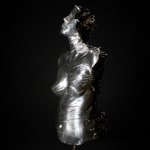 This image depicts a full-view sculpture of a human torso made from aluminum, featuring smoky quartz crystals protruding dramatically from the spine, enhancing the sculpture's dynamic and textured appearance.