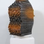 "Mind Bending" a sculpture of a face made from wooden sticks and paint by slate gray gallery artist Gil Bruvel