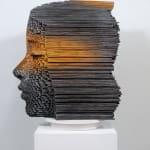 "Mind Bending" a sculpture of a face made from wooden sticks and paint by slate gray gallery artist Gil Bruvel
