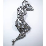 Stainless steel sculpture of a person laying on their side with their arm under their head by slate gray gallery artist David Davis