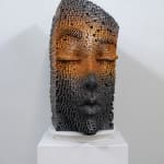 "Mind Bending" a sculpture of a face made from wooden sticks and paint by slate gray gallery artist Gil Bruvel