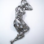 Stainless steel sculpture of a person laying on their side with their arm under their head by slate gray gallery artist David Davis