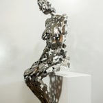 Stainless steel sculpture of a person sitting upright by slate gray gallery artist David Davis
