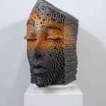 "Mind Bending" a sculpture of a face made from wooden sticks and paint by slate gray gallery artist Gil Bruvel