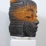 "Mind Bending" a sculpture of a face made from wooden sticks and paint by slate gray gallery artist Gil Bruvel
